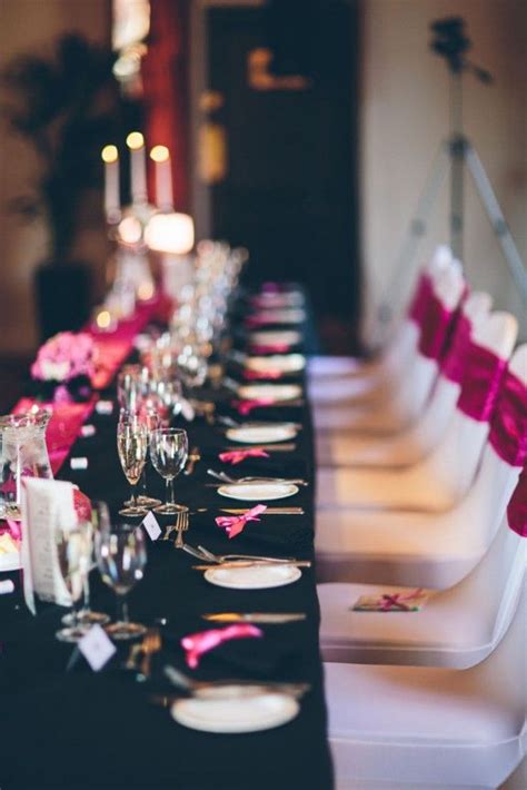 A Beautiful Black And Pink Table For A Glamorous And Modern Wedding With