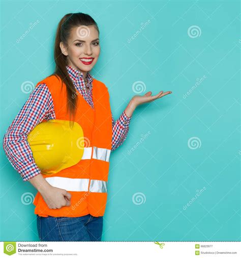 smiling female construction worker presenting stock image image of copy construction 66623977