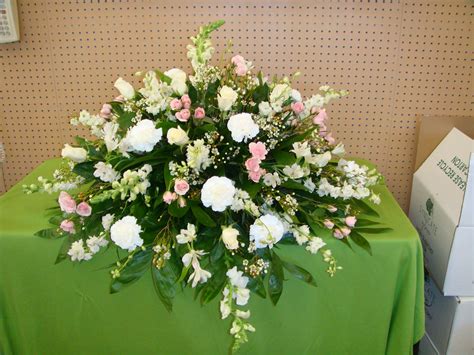 Once the casket saddle is positioned, you can adjust the flowers as needed. CC12 Casket Cover Of Pinks & Whites in Huntsville, AL ...