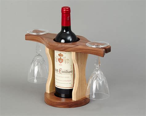 Your glasses will balance on the wood knob as the nose, and the wood circle will hold them secure. Wine Bottle & Glass Holder | Beveledge