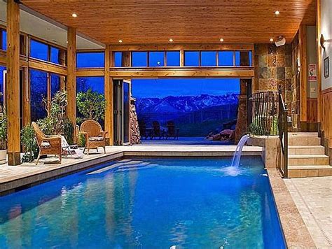 Rustic Swimming Pool With Indoor Pool Fountain French Doors Transom