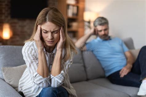 Upset Offended Mature European Husband Ignores Wife Lady Suffers From Headache In Living Room