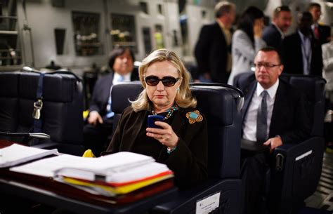 Photo Taken On Airplane Shows Hillary Clinton Checking Out An Article