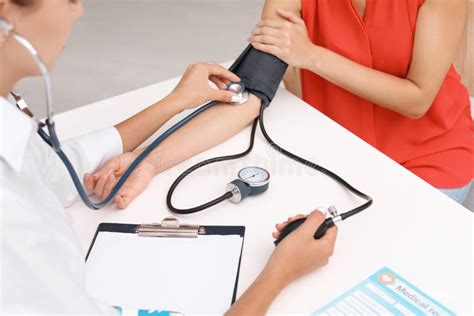 Doctor Checking Patient`s Blood Pressure Stock Photo Image Of Doctor
