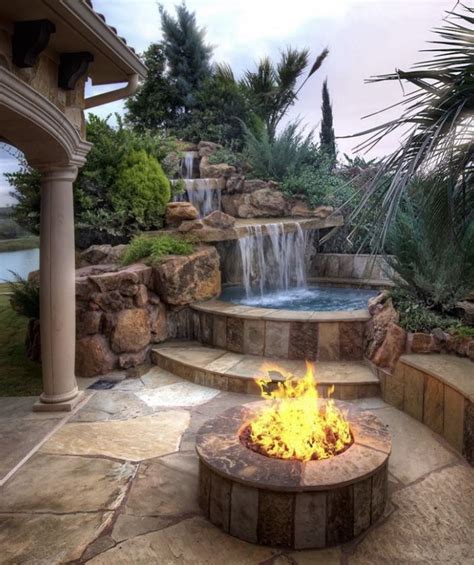 This oceanfront deck offers a hot tub, fire pit, outdoor kitchen and more. Pool and fire pit | Backyard spa, Hot tub backyard, Small ...