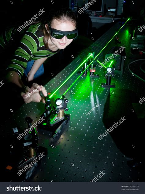 Female Scientist Working Lasers While Doing Stock Photo 70199134