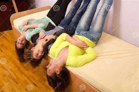 three teenage girls having fun on the bed stock image image of enjoying girls 47628401