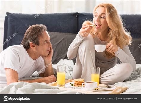 Couple Having Breakfast In Bed — Stock Photo © Tarasmalyarevich 147566513