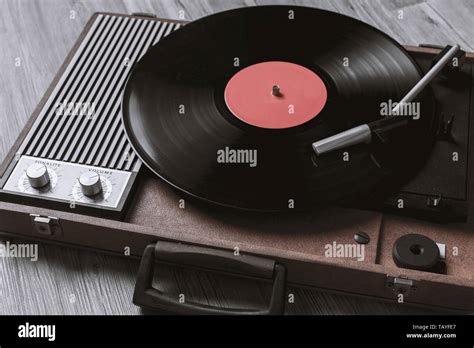 Turntable Vinyl Record Player On The Background Of Their Gray Wooden Boards Needle On A Vinyl