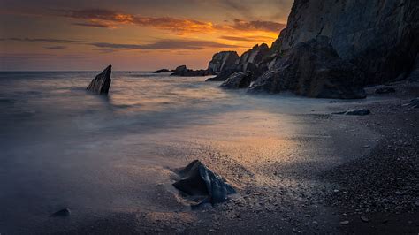 Coast Sunset Rocks Sea Sand Hd Wallpaper Peakpx