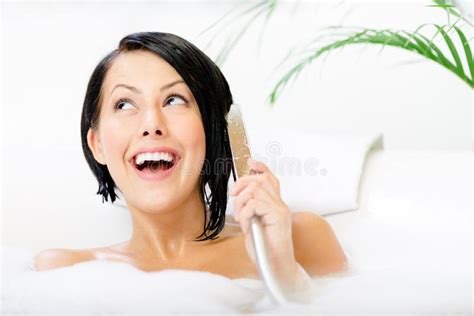 Young Woman Lying In Bathtub Plays With Shower Head Stock Image Image
