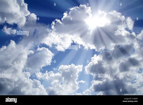 Beams Of Light Sky Blue With White Clouds Cloudscape Stock Photo Alamy