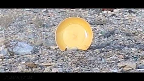 Slow Motion 600fps Bullet Hits Plate On Ground Trimmed V13321 Youtube