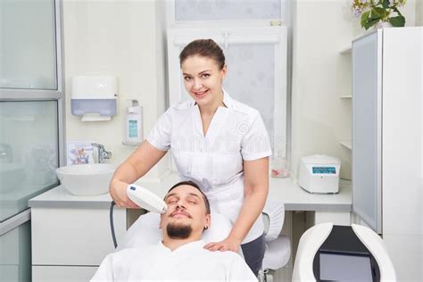 Man Having Laser Treatment At Beauty Clinic Stock Photo Image Of