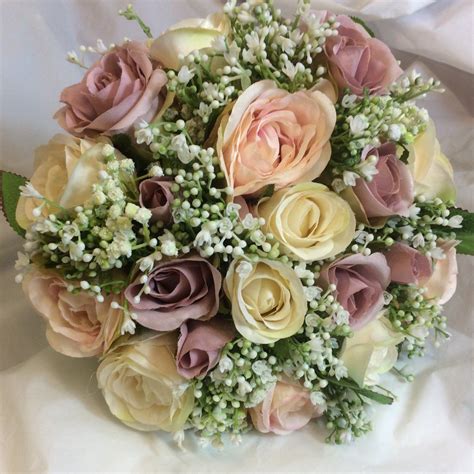a brides bouquet of gypsophila and artificial silk roses bride bouquets silk roses