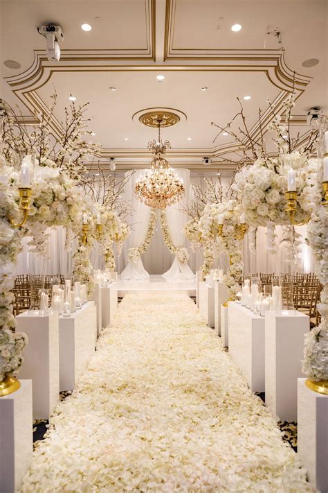 white-and-gold-ballroom-wedding-ceremony-white-flower-petals