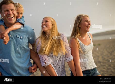 Three Siblings Holding Hands Walk Fotos E Imágenes De Stock Alamy