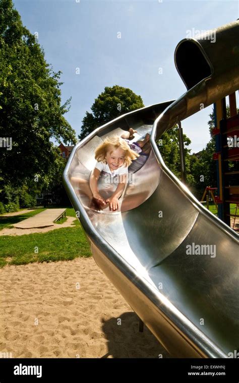 Girl On A Slide Stock Photo Alamy