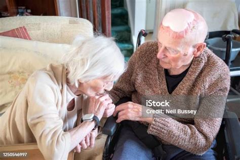 Elderly Couple With Alzheimers And Dementia Showing Affection Towards