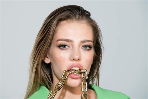 Premium Photo Sensual Woman Close Up Portrait With Golden Chain In Mouth Female Model Lick