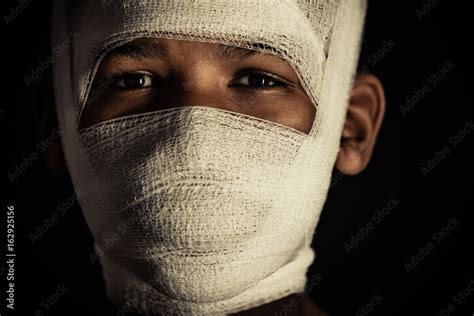 Young Black Boy With Bandages On His Face Stock Photo Adobe Stock
