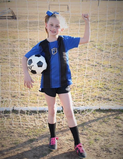 youth individual soccer poses for photography