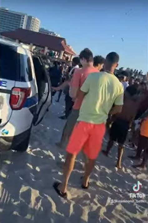 Arrested Spring Breaker Cheered On By Beachgoers As He Flees Cops In Handcuffs
