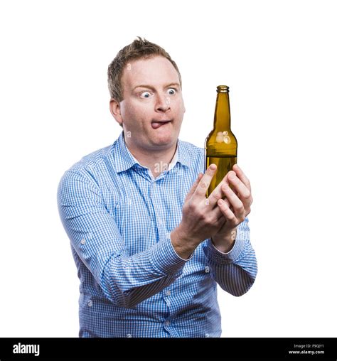 Funny Young Drunk Man Holding A Beer Bottle Studio Shot On White