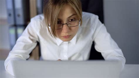Overworked Girl Staring At Computer Screen Eyes Wide Open Working