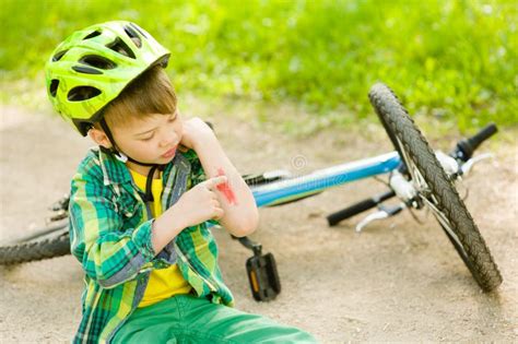 Boy Fell From The Bike In A Park Stock Photo Image Of Care Crash