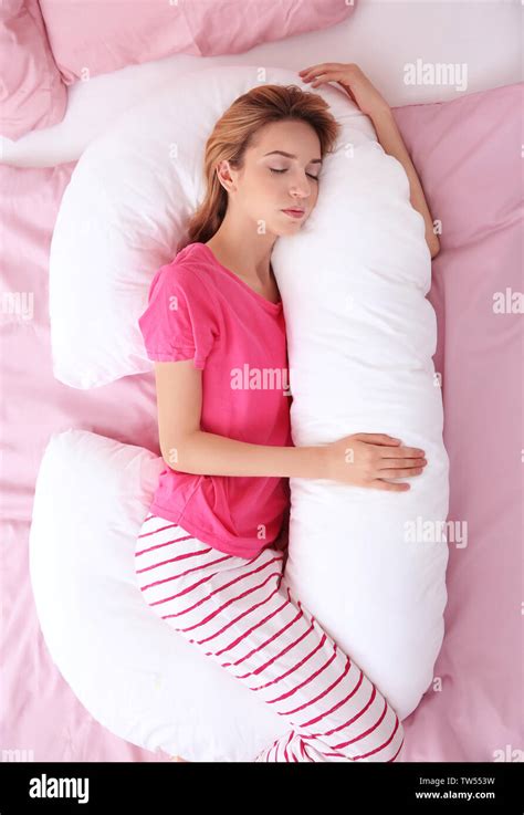 Beautiful Girl Sleeping With Body Pillow In Bedroom Stock Photo Alamy