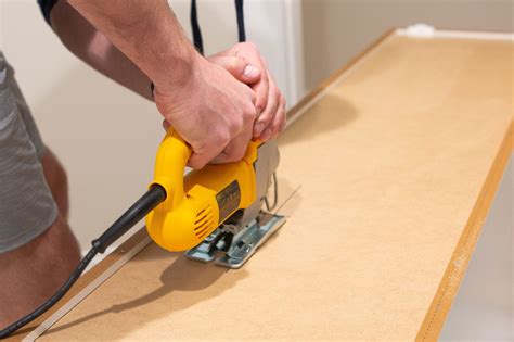 Measure carefully, cut the basket tracks to width, then install them. 9 Tips to Install IKEA Kitchen Cabinets | The DIY Playbook