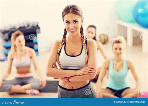 Portrait Of Female Instructor With Her Group In Gym Stock Image Image Of Dancing Exercising