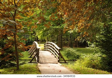 Wooden Bridge Over Stream First Autumn Stock Photo Edit Now 34984933