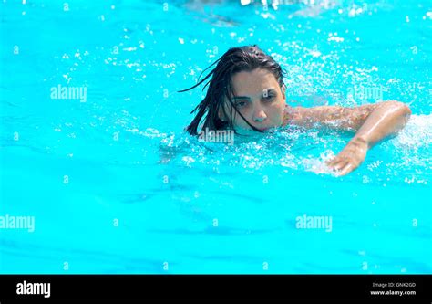 Beautiful Young Woman Swimming In Pool Stock Photo Alamy