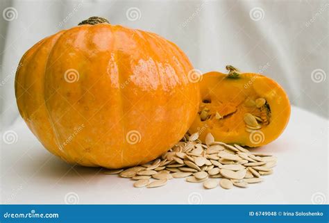 A Pumpkin And Pumpkin Seeds Stock Photo Image Of Background Orange