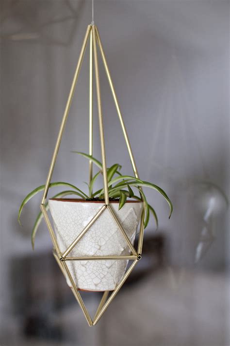 Hanging planters are perfect for small, compact spaces, as it taps into the vertical planting trend; Make a DIY Hanging Himmeli Plant Holder