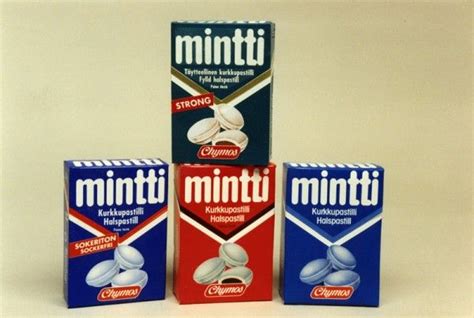 Three Boxes Of Mintti Sitting Next To Each Other On A White Surface