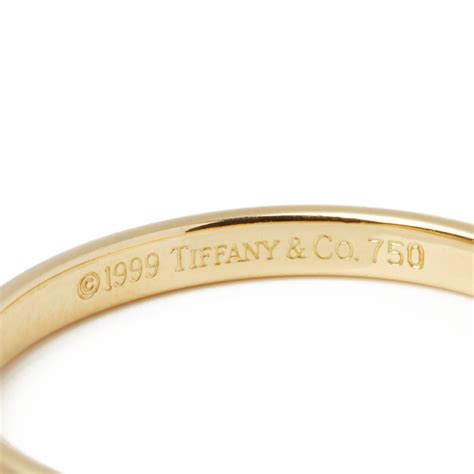 Tiffany & co is well known for their classic tiffany engagement rings. Tiffany & Co. 18k Yellow Gold 2.03mm Court Wedding Band COMJ446 | Second Hand Jewellery