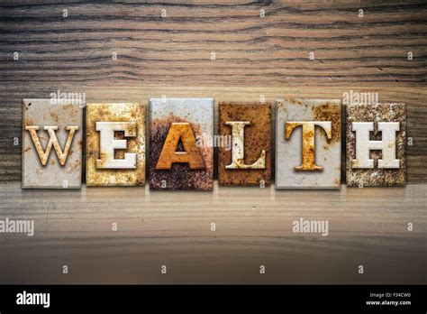 The Word Wealth Written In Rusty Metal Letterpress Type Sitting On A