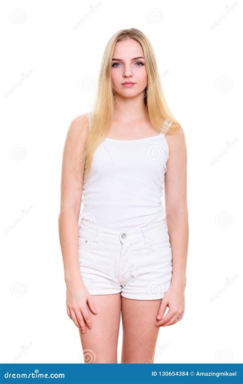 Studio Shot Of Young Beautiful Teenage Girl Standing Stock Photo