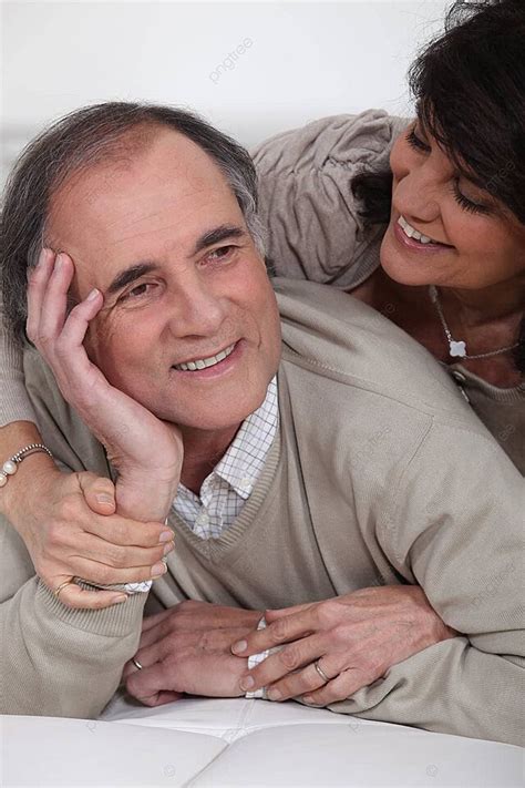 A Mature Couple Laying On Their Bed Husband Pensioner Together Photo