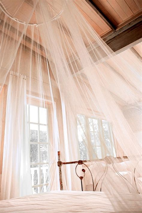Find more of our craft ideas on country homes and interiors' website. How to Make Your Own Sheer Mosquito Netting Canopy | Hunker
