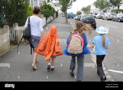 Children returning home from school in Falmouth, UK Stock Photo ...