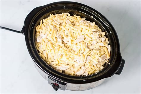 Place 3 tortillas in the bottom of the crock pot. Crock Pot Chicken Enchilada Casserole Recipe