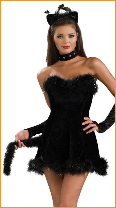 A Woman In A Black Cat Costume Posing For The Camera With Her Hands On