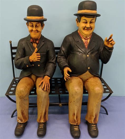 Sold At Auction Laurel And Hardy Figures On Metal Bench