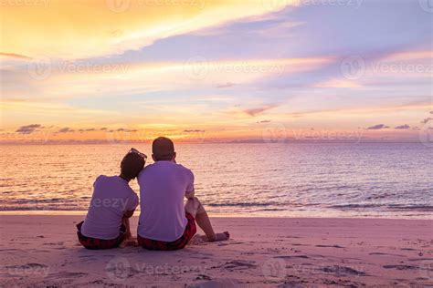 Romantic Couple On The Beach At Colorful Sunset On Background Perfect