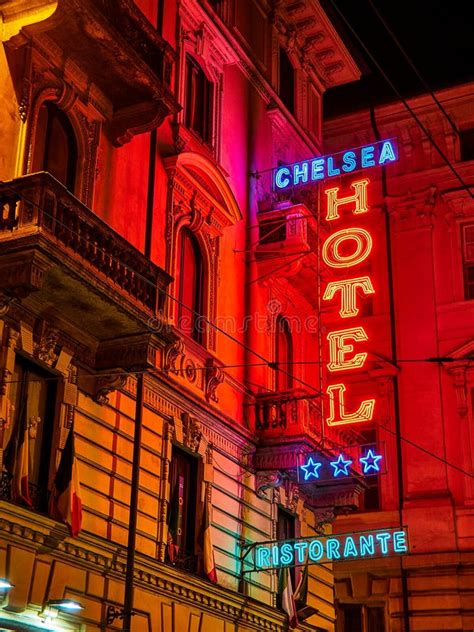 Hotel And Ristorante Neon Signboard In An Italian Street At Night