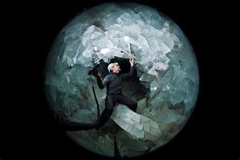 A Researcher Stands Inside The Crystal Filled Cave Known As The Pulpí